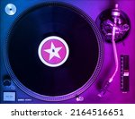 DJ turntable with blue and pink lighting playing vinyl record. Colorful music party background