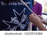Small photo of Singapore - AUGUST 19, 2016: First aid triangular bandage