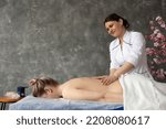 Small photo of Female professional medical physiotherapist do anti cellulite massage female. lying on special table. Get rid visceral fat, heal skin, muscle. Cosmetic beauty treat, posture correction. Copy space