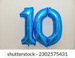 One and zero blue helium balloons make a great celebration surprise for a ten year anniversary or tenth birthday  