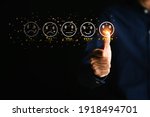Small photo of Customer service and Satisfaction concept ,Businessman are touching the virtual screen on the happy Smiley face icon to give satisfaction in service. 5-star rating very impressed.