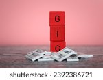 Small photo of Wooden blocks with alphabets GIG and pile of money. Gig economy concept.