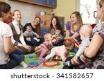 Small photo of Group Of Mothers With Babies At Playgroup