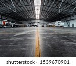Airplanes In A Hangar With...