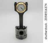 Small photo of Piston clock, desktop clock made from car parts. Upcycled engine piston and conrod. Timepiece for office desk.