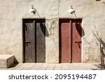 Arabic style carved wooden doors in Al Fahidi Historical District, Deira, Dubai, United Arab Emirates. 