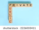 Small photo of Public private partnership or ppp concept. Wooden blocks crossword puzzle flat lay.