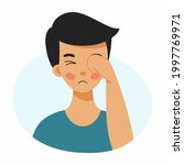 boy rubs his face with his hand.... | Shutterstock .eps vector #1997769971