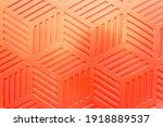Red plastic surface with repetitive geometric shapes. Seamless geometrical patterns with rhombuses, lines and corners. Stamped plastic surface with simple geometric lines. Space for inserting text