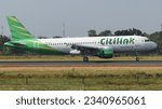 Small photo of Boyolali, Central Java, Indonesia-July 29, 2023: Citilink, PK-GLN, Airbus A320-214, deploying thrust reverser after touching down runway 26 of Adi Soemarmo Airport