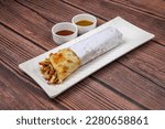Small photo of Veg Spring Roll OR Wrap also known as Franky, made using Paneer and Vegetables stuffed inside Chapati .