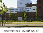 Small photo of Delft, The Netherlands - May 13, 2019; Historical name designation on the facade of the factory of the Royal Dutch Gist and Spiritus factory.