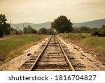 An Old Rail Road Track With...