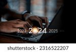 Small photo of Trend of 2024. people business investor using laptop with virtual 2024 year diagram, business trend, change from 2023 to 2024, strategy, investment, business planning and happy new year concept