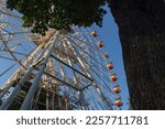 A Large Ferris Wheel In An...