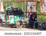 Small photo of Jakarta, Indonesia August 22, 2023 .A shoe sole repairman is waiting for a customer next to him to provide soles to replace damaged soles
