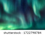 Abstract lines of aurora borealis in the night sky full of stars