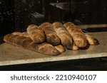 Small photo of Maribo, Denmark Oct 4, 2022 Fresh baguettes in a bakery window.