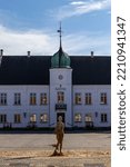 Small photo of Maribo, Denmark Oct 4, 2022 The City AHll and a statue in a dry fountain.