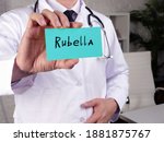 Small photo of Health care concept meaning Rubella german measles with sign on the piece of paper.
