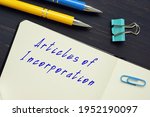 Small photo of Business concept about Articles of Incorporation with phrase on the piece of paper.