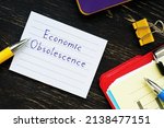 Small photo of Business concept meaning Economic Obsolescence with inscription on the sheet.