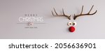 Reindeer with red nose and Merry Christmas text on gray background 3D Rendering, 3D Illustration