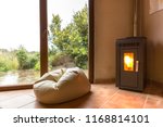 Small photo of Empty room with a cozy corner and a flickering fireplace