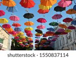 Small photo of Such an umbrella is in noways a boring necessity or a salvation from weatherbeat, but the main accessory of the flying summer.