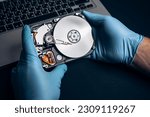 Small photo of Computer service engineer technician workplace repairing fixing disassembled HDD hard drive data disc SSD, backup part of PC or laptop. Recovery, maintenance work, access file. Profession repairman