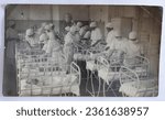 Small photo of Veliky Ustyug of the Vologda region of the USSR retro photography, Circa 1940. Students of the medical school at practical classes in the city maternity hospital in the ward with newborns. Vintage