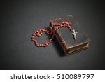 Rosary On The Old Bible 