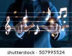 Abstract woman hands playing music notes on dark background, music concept