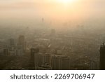 Small photo of Bad air pollution in City. PM 2.5 dust in Bangkok or center city, Capital city are covered by heavy smog, Misty morning and sunrise in downtown with bad air pollution, Place to risk of cancer,Thailand