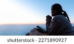 Small photo of Silhouette of woman kneeling down praying for worship God at sky background. Christians pray to jesus christ for calmness. In morning people got to a quiet place and prayed. Banner with copy space.
