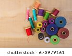 multicolored coils with threads ... | Shutterstock . vector #673979161