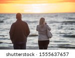 Jurmala, Latvia. Sunset at the Baltc sea. Man and woman at sunset