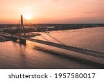 Bridge Over River At Sunset