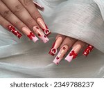 Long acrylic nails set pink French tip, red nail, strawberry design on nails. Professional nail art design
