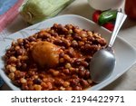 Small photo of A close up photo of a plate of githeri. Githeri is a staple Kenyan food made from beans and corn. Horizontal orientation.