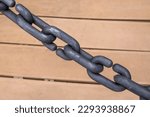 Small photo of an iron chain. Close-up, the concept of strength, mutual assistance, arrest, imprisonment, cumbersome, justice, unity, togetherness, solidarity, inseparable.