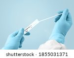 doctor, nurse or medical technologist in medical gloves holds a set with a test tube for a test for covid19, coronavirus. DNA PCR Testing Protocol