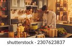 Small photo of Charming Indian Couple Preparing Food Together: Laughing and Sharing Stories, Creating Delicious Meals, Strengthening Their Bond in a Cozy Kitchen.