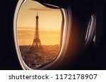 Eiffel as seen through window of an aircraft.