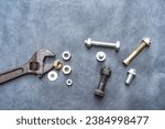 Small photo of Wrench, hex bolt and hex nut on leather floor.