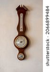 Small photo of BANGKOK, THAILAND - OCTOBER 18, 2021 : vintage wooden weather station with thermometer, barometer and hygrometer hanging on white wall