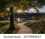 Small photo of Breath taking sunset at Watershed Nature Center. Relaxing pathway by the edge of the wetlands located near Edwardsville, Illinois