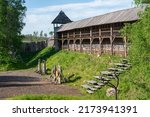Small photo of Fortress of the vikings with high timber walls and towers. Barracks of the viking warriors. Historical defencive structure of the nordic warriors.