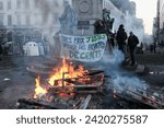 Small photo of Brussels, Belgium - February 01, 2024: Farmer protest during EU summit at the Luxembourg Square - Vandalism of the John Cockerill monument, one of the statues replaced by a doll.