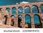 Small photo of The ancient Roman aqueduct of Segovia, one of the best-preserved elevated Roman aqueducts and the foremost symbol of Segovia.